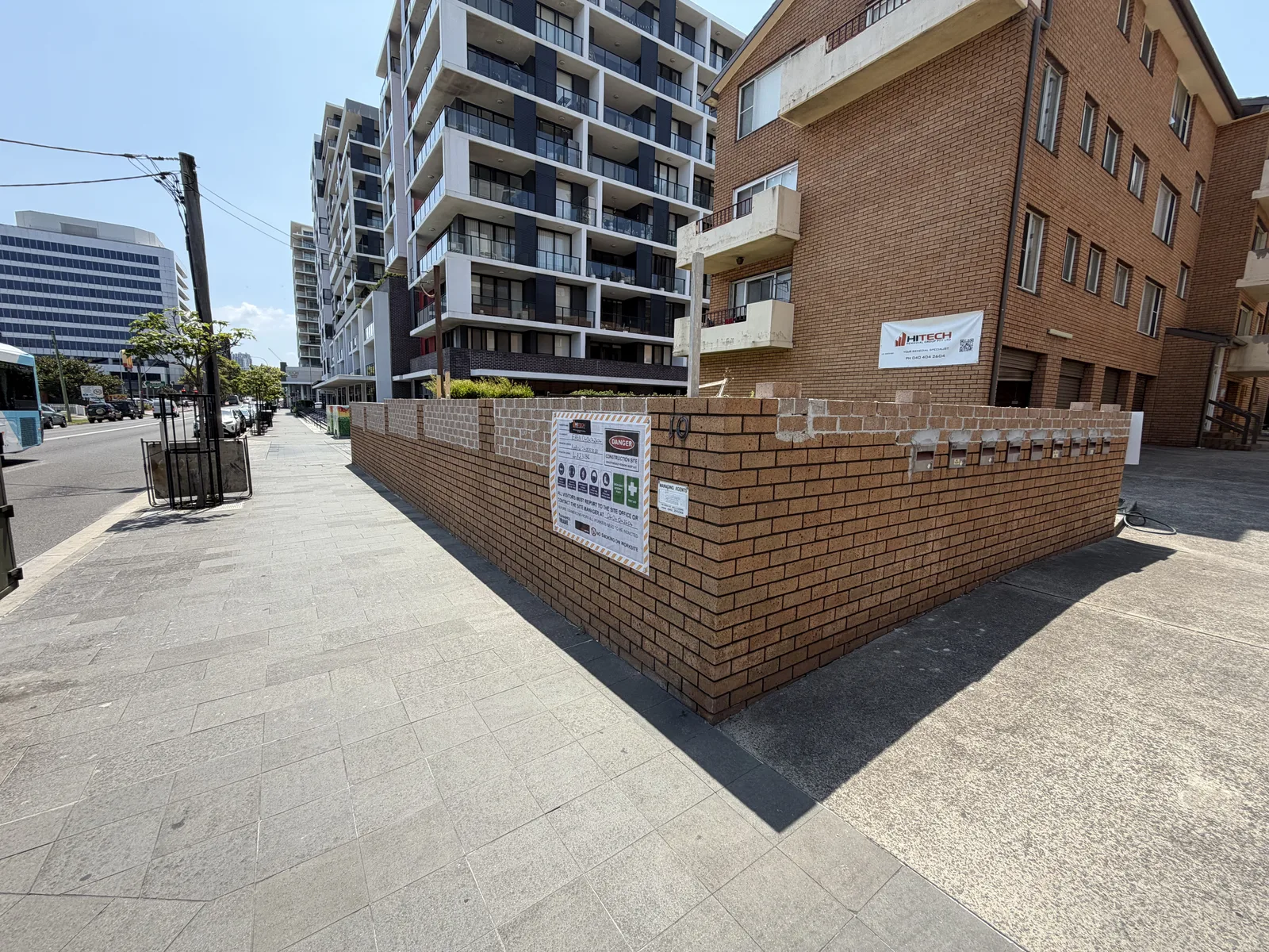 Street-level view of the apartment site